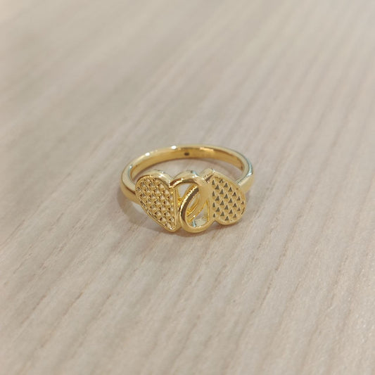 Angled front view of 916 gold cross heart ring