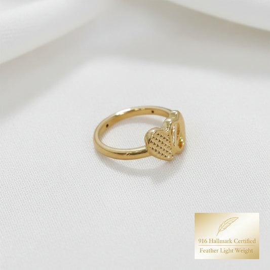 Side view of 916 gold cross heart ring