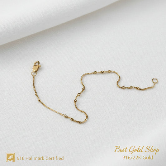 Close-up of fancy bead stations on a 22K Gold bracelet.