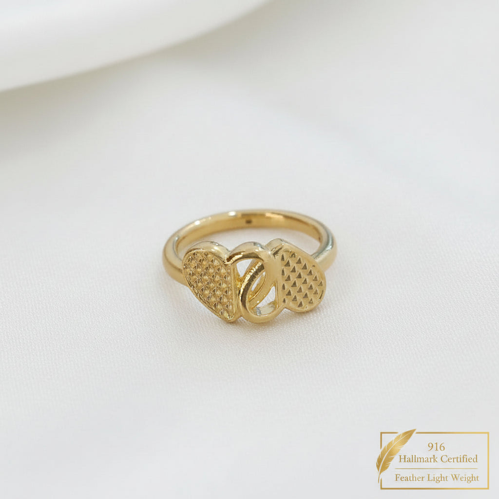 Angled front view of 916 gold cross heart ring