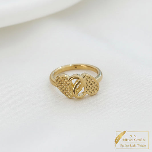 Angled front view of 916 gold cross heart ring