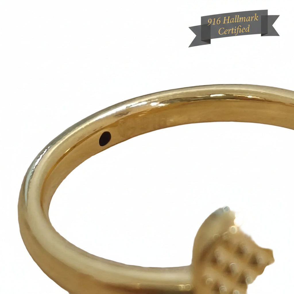 Close-up detail of 916 gold cross heart ring band