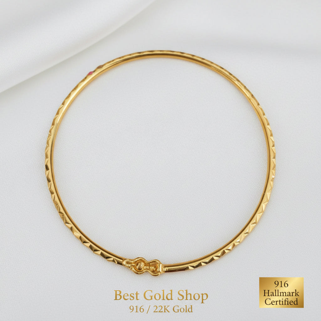 916 gold diamond-cut slim bangle with sparkling geometric facets