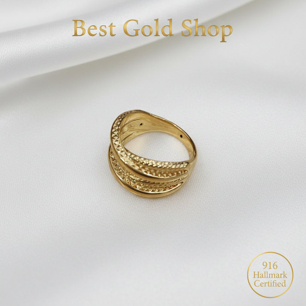 Close-up of textured 916 gold double cross ring details