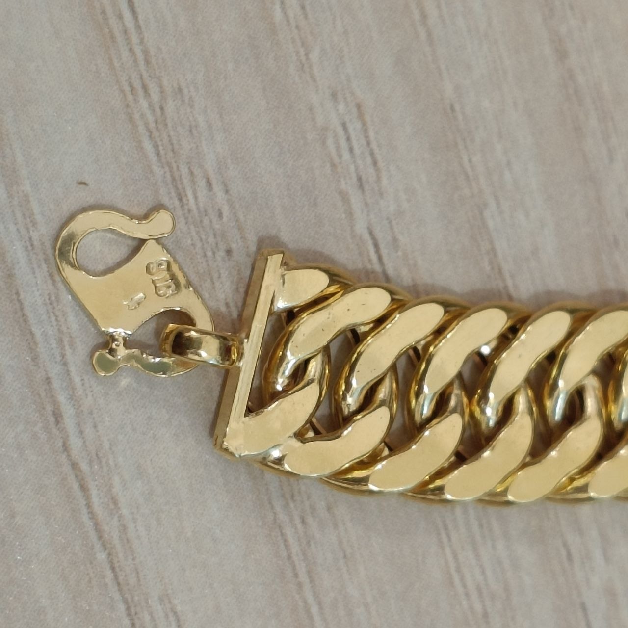 Full view of the 916 gold hollow Lipan statement bracelet
