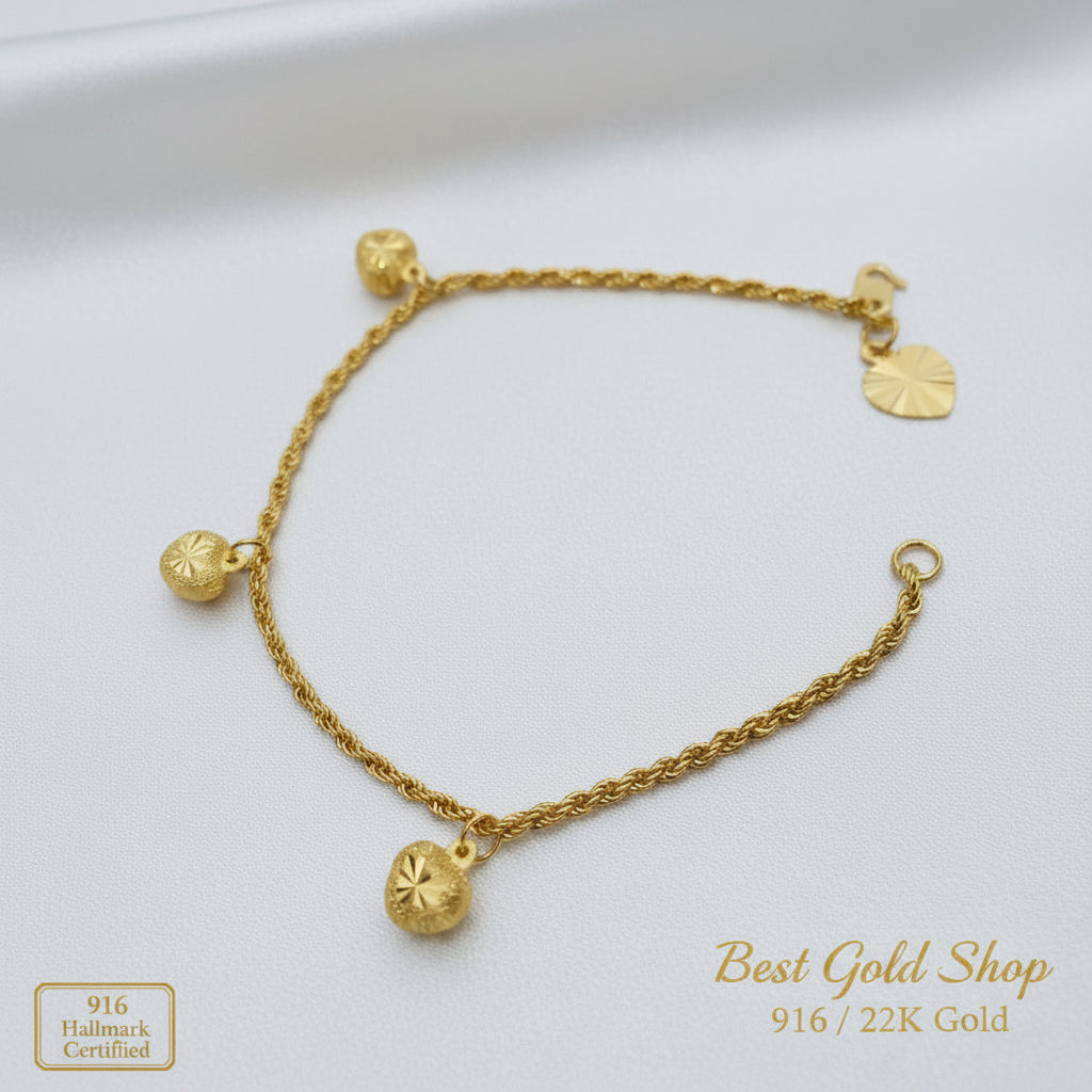916 Gold hollow rope bracelet and heart charms angled view