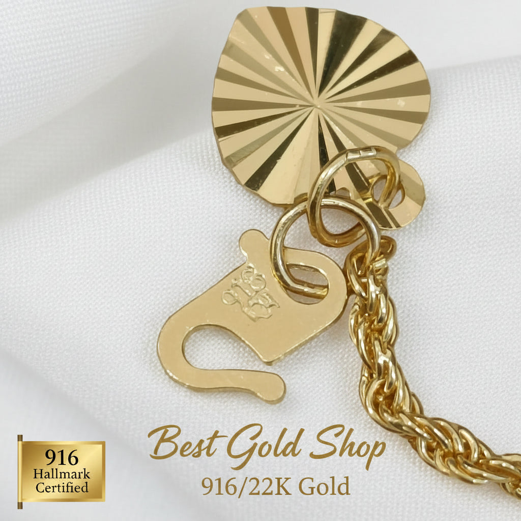 916 Gold hollow rope bracelet clasp and heart charm close-up