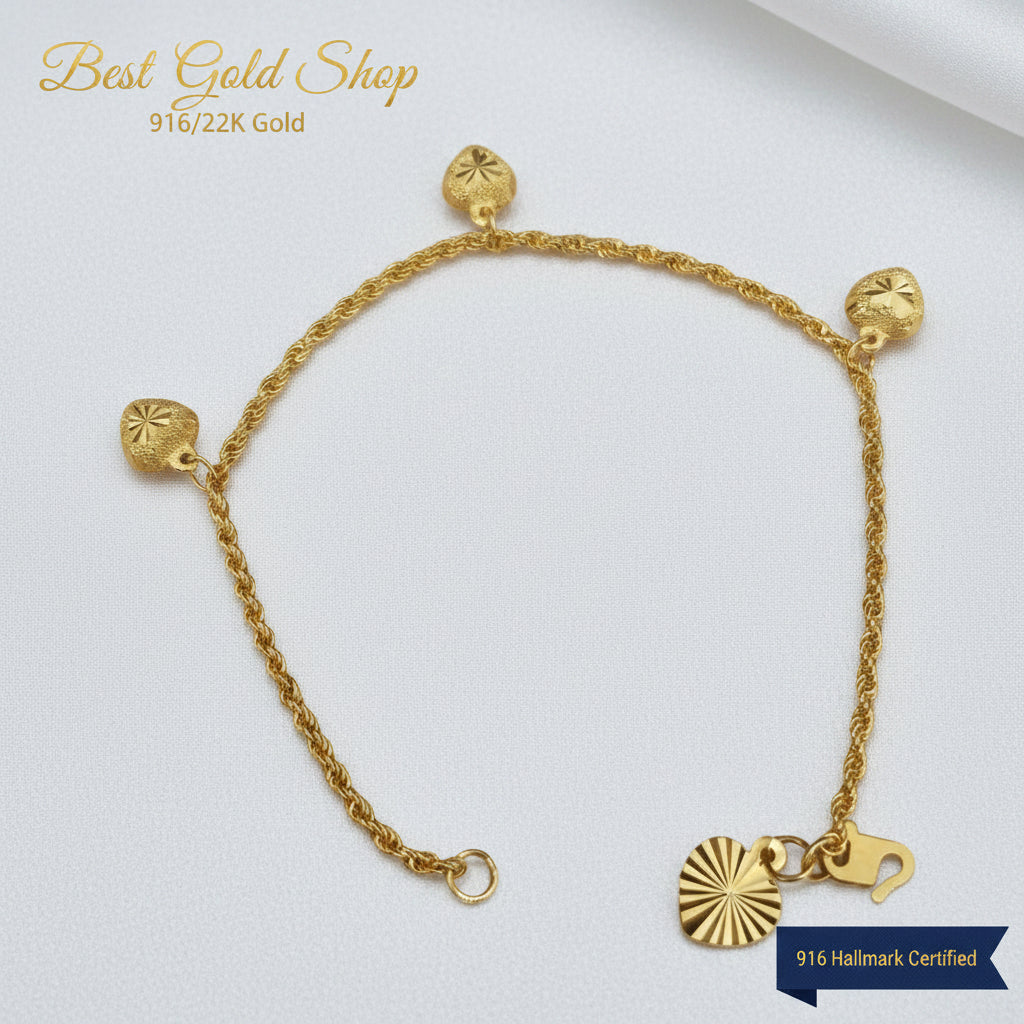 916 Gold hollow rope bracelet showing heart charms and clasp