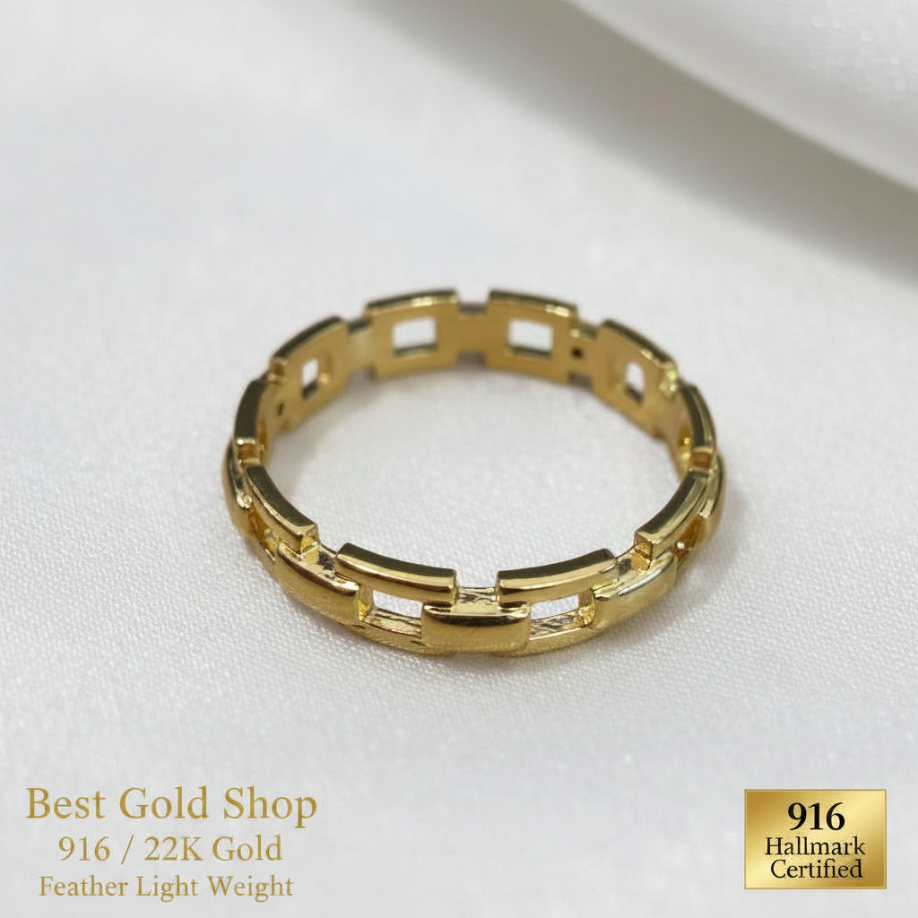 916 gold chain-link ring photographed at an angle on white satin