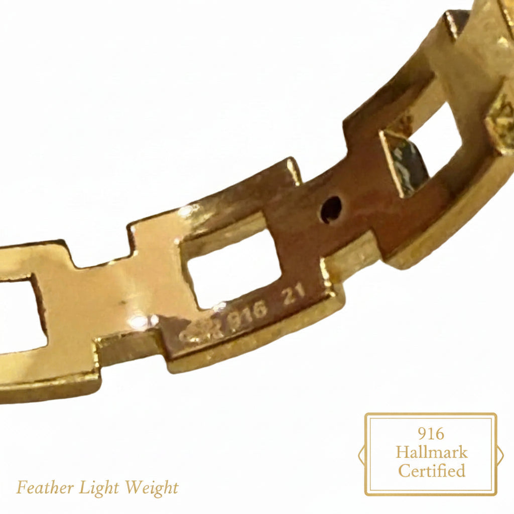 Close-up of hallmark and size markings on the 916 gold chain-link ring