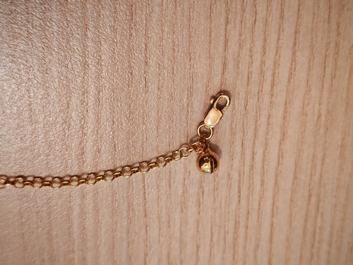 916 Gold anklet bell and clasp detail