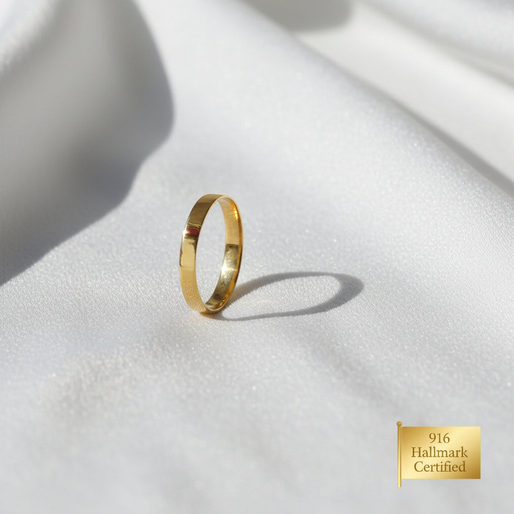 Angled view of 916 gold slim plain polished band ring