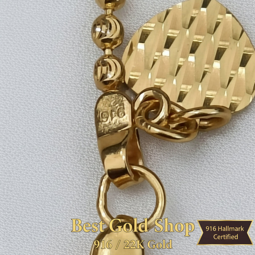 Detailed view of polished solid beads on a 916 Gold bracelet.