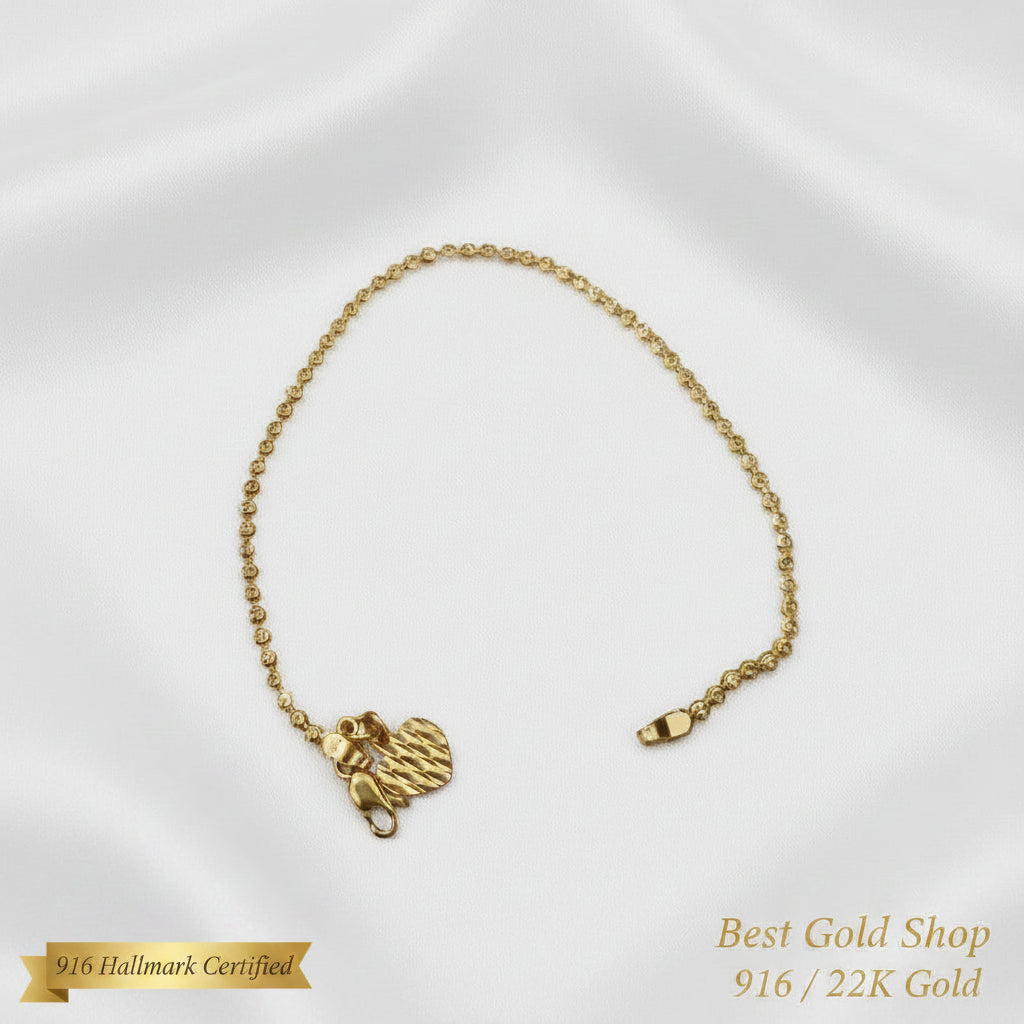 Full view of 916 Gold Solid Bead Bracelet with Heart Charm.