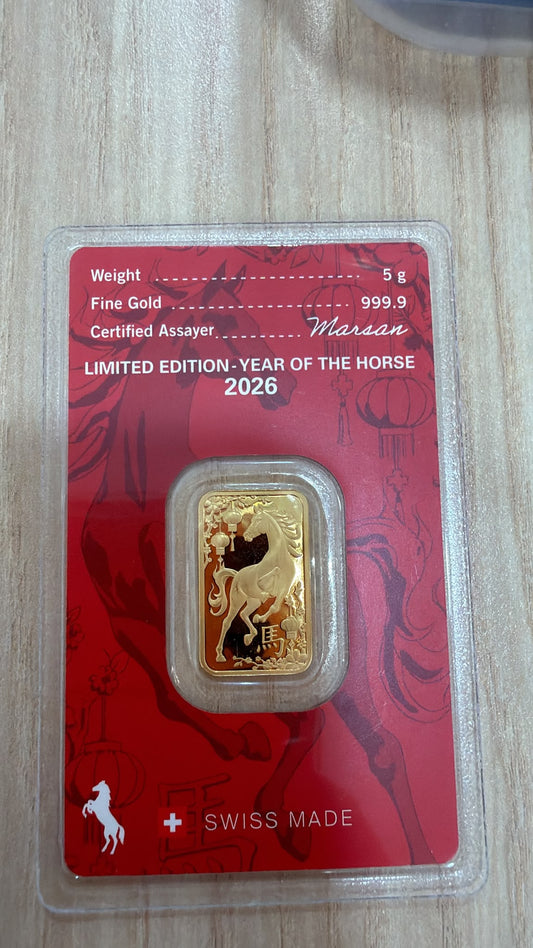 Owner-supplied photo of a 5g Argor-Heraeus 2026 Year of the Horse gold bar, horse-design side in red assay packaging.